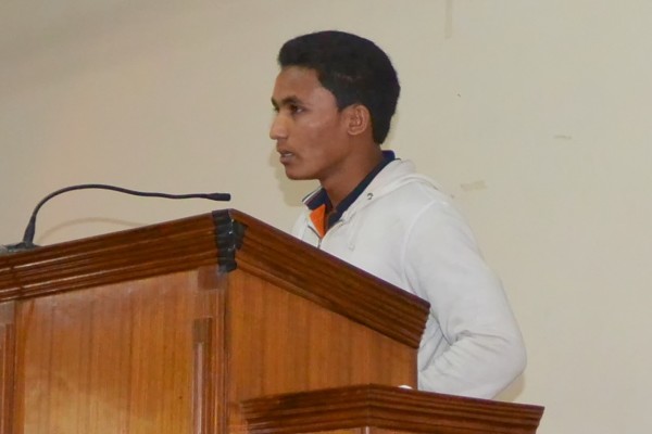 This is a photo of Samar last year giving his testimony in church.